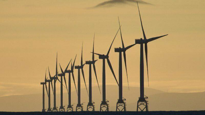 Row of 10 offshore wind turbines.
